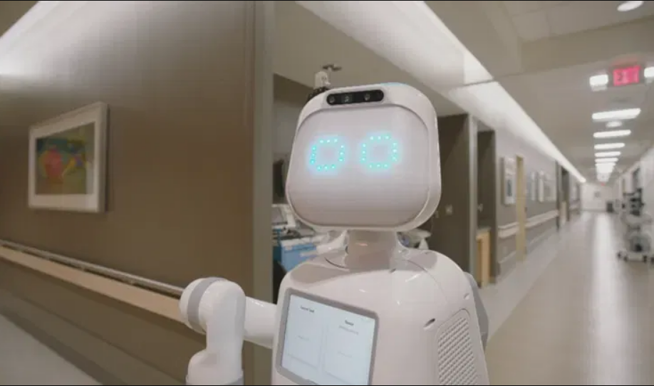 Diligent Robotics ha implementado sus robots Moxi impulsados ​​por IA en más de 30 hospitales para ayudar a las enfermeras a realizar tareas menores como suministros y entrega de medicamentos, completando 500.000 entregas a finales del año pasado y ayudando a reducir el agotamiento del personal. (Imagen cortesía de Diligent Robotics)