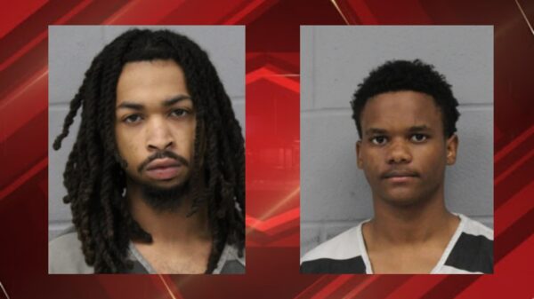 Two mugshots side by side: left man with long dreadlocks and beard, right man with short hair in striped shirt against gray wall