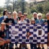 Group of people posing outdoors holding a memorial banner for David McLemore in Houston, Texas