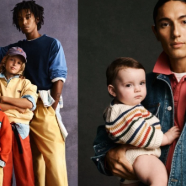 Group of models in bold color-block streetwear; a man in denim holds a baby on the right.