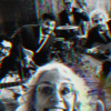 Older woman in front taking a selfie with a four‑piece band in a rehearsal space, features guitar, violin, and drums; image has a red/blue glitch effect.