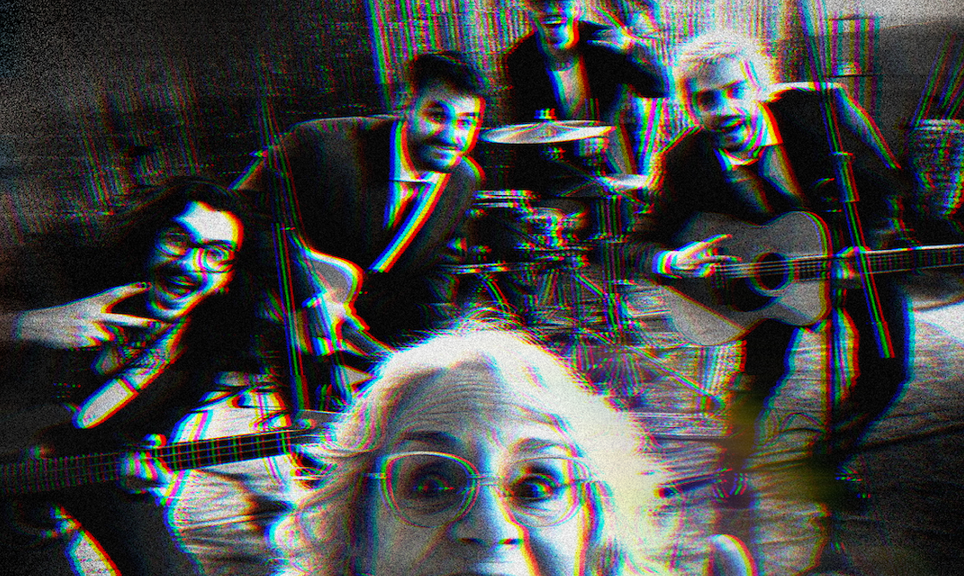 Older woman in front taking a selfie with a four‑piece band in a rehearsal space, features guitar, violin, and drums; image has a red/blue glitch effect.