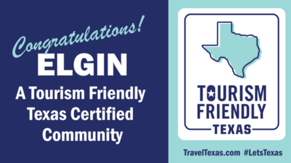 Elgin earns Tourism‑Friendly Texas Certified Community badge, shown as a split dark blue and teal graphic with the certification message.